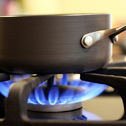 Inside Gas Lines, pot on the stove with a gas burner